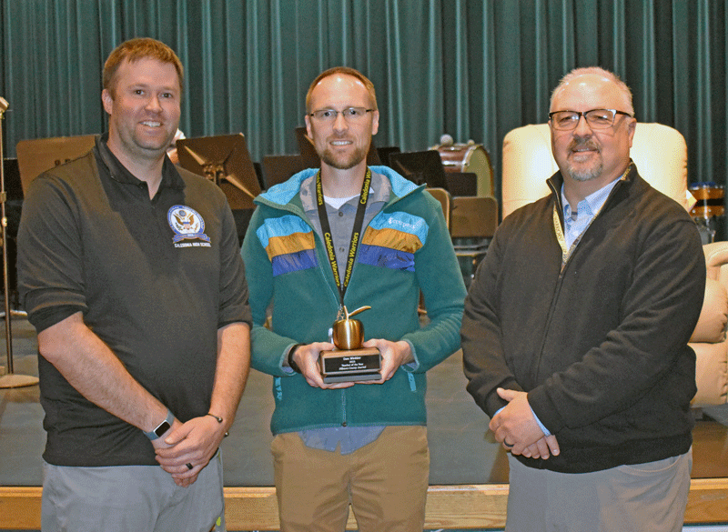 Teacher of the Year Dan Winkler, center, along with Caledonia Principal Nathan Boler, left, and Superintendent Craig Ihrke. Photo by Barb Jeffers