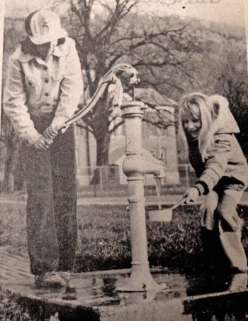 Nicole and Joey Napoli, daughters of Mr. and Mrs. Dennis Napoli, then of Brownsville, Minn., draw water from the pump in Irma Bissen’s yard in 1981. Photo courtesy of the La Crosse Tribune and the Houston County Historical Society