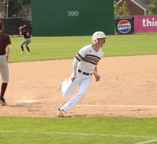 Caledonia’s Ben Stemper rounds third and heads home to score on a Tyson Ginther RBI-double in the second inning of the Warriors’ playoff game versus Pine Island. Caledonia fell 8-2 in the contest, but came back and beat Cannon Falls 5-2 to make the Section 1AA championship game. Photo by Paul Trende