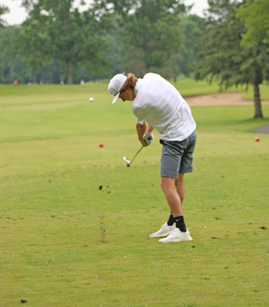 Fillmore Central senior Aiden Arnold, shown above attacking the fairway with an iron, took on his third state golf meet. Shooting a 165, Arnold tied for 32nd place overall. Photo by Paul Trende