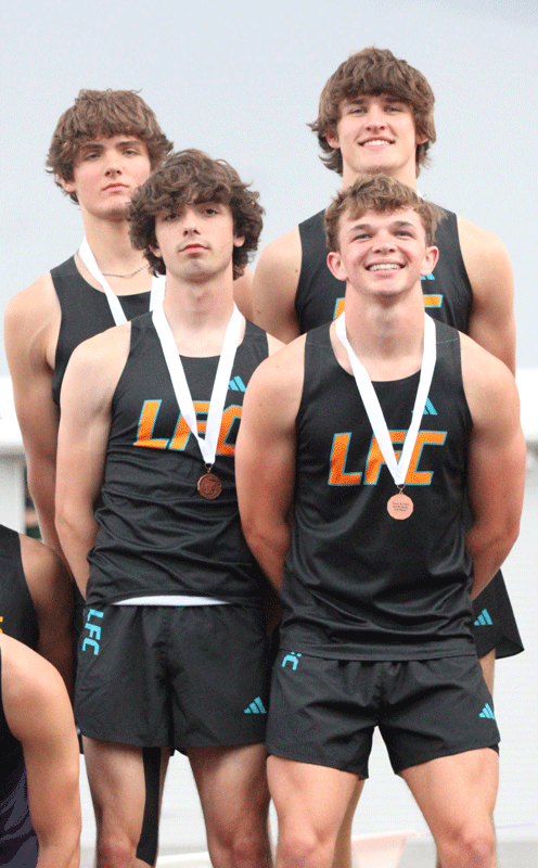 Taking third place at the 1A track and field meet but setting a program-record (44.16) was the LFCMC boys 4x100 (back Adrian Rindels and Greg Kennedy, front Davis Penhollow and Weston Collins). Said team made state by standard. Kennedy also qualified in the 200-meters and Long Jump. Photo by Paul Trende