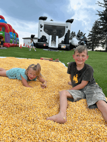 Arnie and Rae Boyum having fun in the shelled corn. Photo by Wanda Hanson