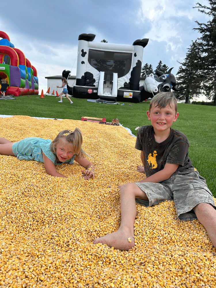 Arnie and Rae Boyum having fun in the shelled corn. Photo by Wanda Hanson