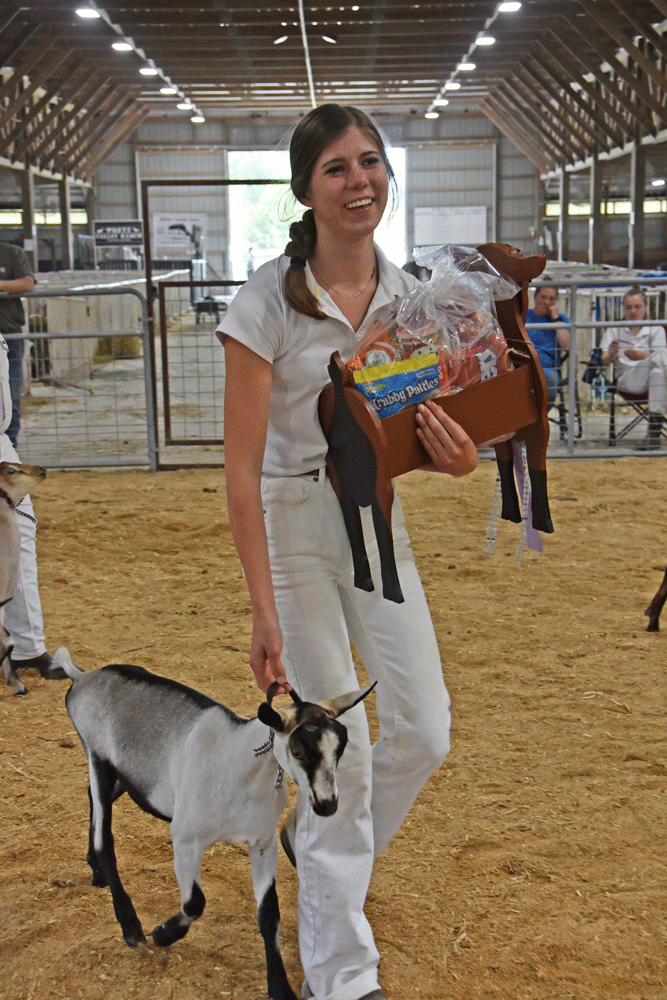 Amelia Abraham of Abe’s Acres, North Dakota, and her Alpine doe, Stylish Lucille, take home Best in Show Junior Doe in the MDGA Youth division. Photo by Charlene Corson Selbee