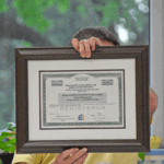 At the June 17 Mabel-Canton School Board meeting, Jodie Zesbaugh with Ehlers & Associates recognized the school for receiving a credit rating of A2 up from A3. Photo by Charlene Corson Selbee