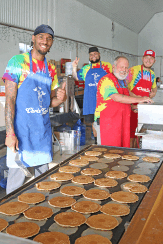 Chris Cakes, of Chris Cakes Pancake Catering and his crew were all smiles serving up pancakes for the crowd at Olmsted County Breakfast on the Farm 2025.