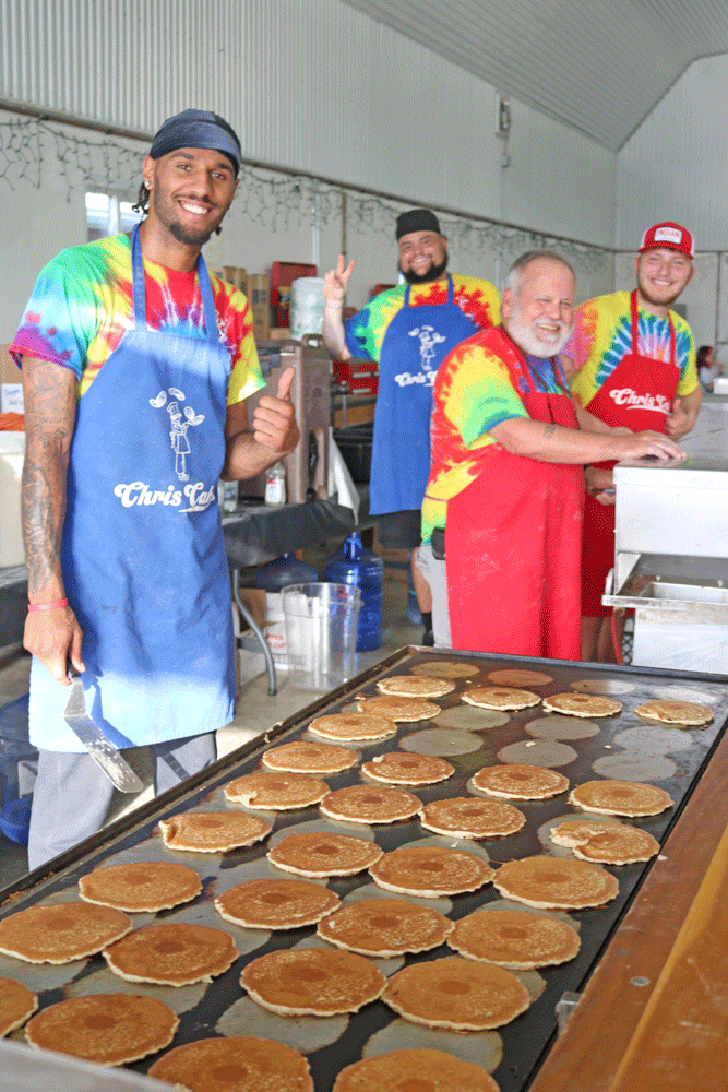 Chris Cakes, of Chris Cakes Pancake Catering and his crew were all smiles serving up pancakes for the crowd at Olmsted County Breakfast on the Farm 2025.