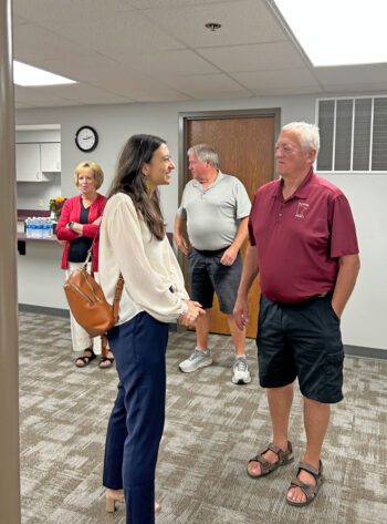 New SMIF CEO Benya Kraus visits with Fillmore County Commissioner Duane Bakke in the foreground. In the background are Preston Area Community Foundation Director Brenda Reicks and Mayor Kurt Reicks. Photo by Wanda Hanson