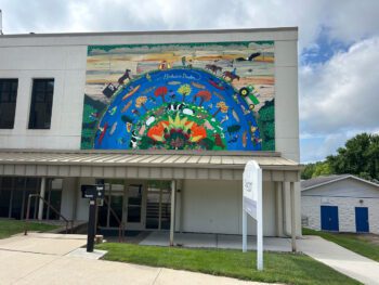 The mural at the Preston City hall/Library which was funded by SMIF is enjoyed by visitors. Photo by Wanda Hanson