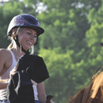 Lauren Olson, a Fillmore County 4-H horse project member, is recognized for always smiling when working with her horse. Photo by Charlene Corson Selbee