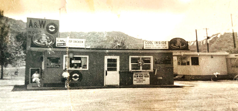 The A&W root beer stand in Houston and the trailer behind where the owners lived before both were destroyed by a tornado. Photo submitted