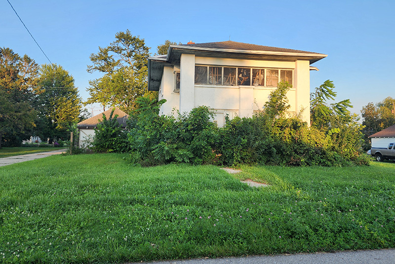 The long-abandoned house at 421 Minnesota Street in Ostrander has been a hazardous property and is at the center of the city council’s efforts to have it demolished. Photo by Zech Sindt