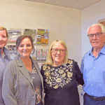 Caledonia residents pledge $1.5 million toward a new Caledonia library. From left to right: Bethany Klinski, assistant director; Stephanie Eggert, director, and Sharon and Chuck Schulte. Photo by Charlene Corson Selbee