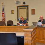 Houston County Commissioners Linda Wright, Kurt Zehnder, Bob Schuldt and Greg Myhre reviewed payments at the August 5 commission meeting. Photo by Charlene Corson Selbee