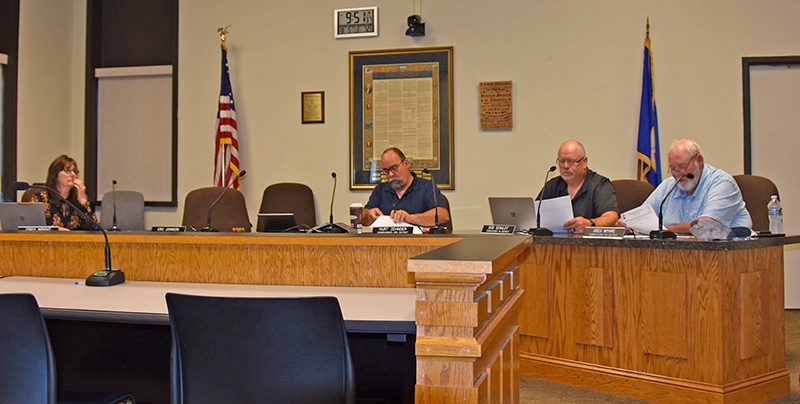 Houston County Commissioners Linda Wright, Kurt Zehnder, Bob Schuldt and Greg Myhre reviewed payments at the August 5 commission meeting. Photo by Charlene Corson Selbee