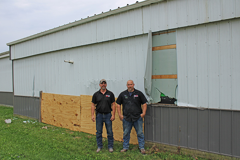 Preston Service Plus owners Justin Jones and Craig Bond standing in front of their building that was struck by an alleged drunk driver in the early morning of August 8, 2025. Photo by Jason Sethre