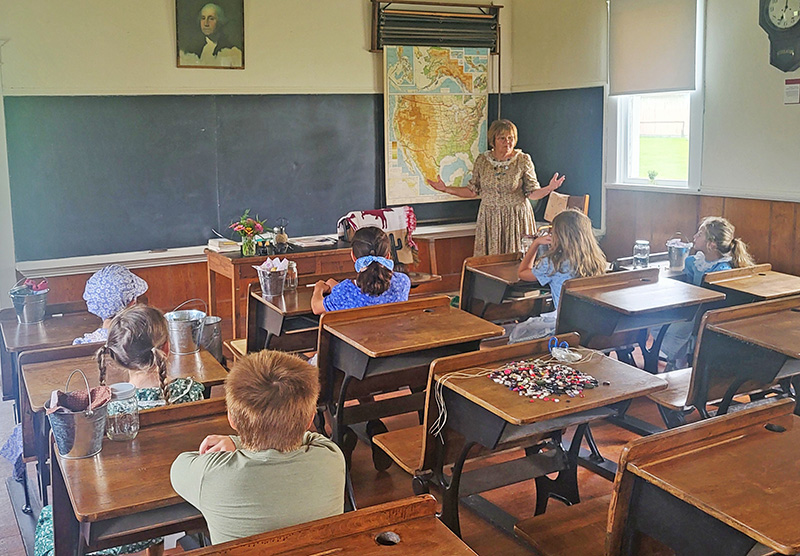 Marilyn Erdman teaches the Prairie School students about life on the prairie. Photo by Hannah Wingert