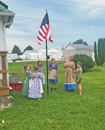 Prairie School begins with the Pledge of Allegiance. Photo by Hannah Wingert