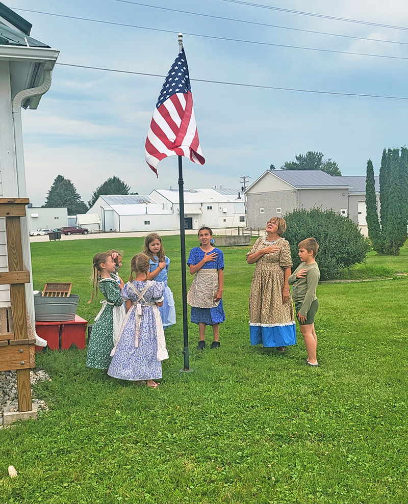 Prairie School begins with the Pledge of Allegiance. Photo by Hannah Wingert