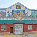 The life and times of Dr. Norman Borlaug are illustrated on a 50' x 30' mural in Cresco, Iowa. Photo by Charlene Corson Selbee