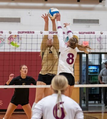 Caledonia’s Elsa Blum (#4) and Chatfield’s Harper Goldsmith (#8) contend at the next for the ball in the teams ranked-versus-ranked TRC matchup. The #6 Warriors (4-0, 10-1) stayed perfect in TRC play with a tight 3-0 sweep (25-23, 26-24, 25-23) of the #3 Gophers. Photo by Leif Erickson