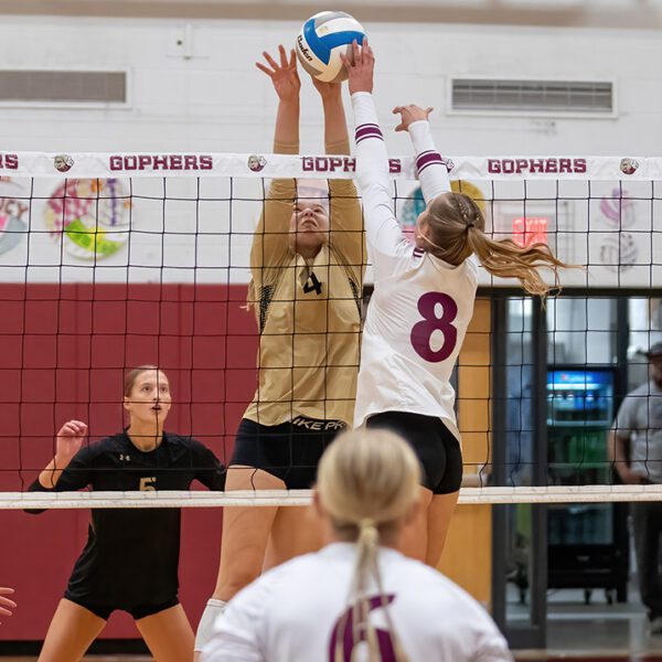 Caledonia’s Elsa Blum (#4) and Chatfield’s Harper Goldsmith (#8) contend at the next for the ball in the teams ranked-versus-ranked TRC matchup. The #6 Warriors (4-0, 10-1) stayed perfect in TRC play with a tight 3-0 sweep (25-23, 26-24, 25-23) of the #3 Gophers. Photo by Leif Erickson