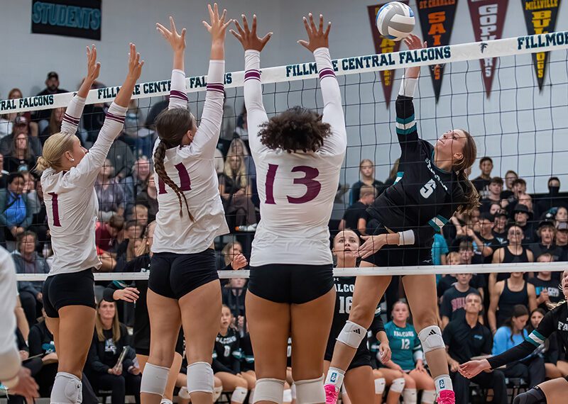 Fillmore Central’s Lauren Dahly encounters the triple block of Chatfield defenders Trindy Barkeim (#1), Julia Goldsmith (#11), and Amaya Harmening (#13). In a battle of the #3 teams in Class A and Class AA, FC ended Chatfield’s two-plus year TRC win-streak via 3-1 final. Photo by Leif Erickson