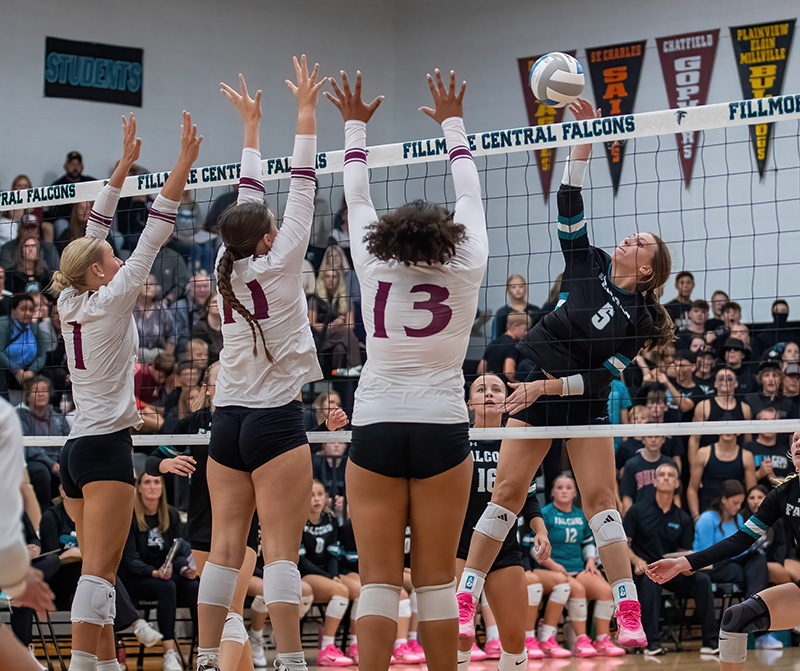Fillmore Central’s Lauren Dahly encounters the triple block of Chatfield defenders Trindy Barkeim (#1), Julia Goldsmith (#11), and Amaya Harmening (#13). In a battle of the #3 teams in Class A and Class AA, FC ended Chatfield’s two-plus year TRC win-streak via 3-1 final. Photo by Leif Erickson