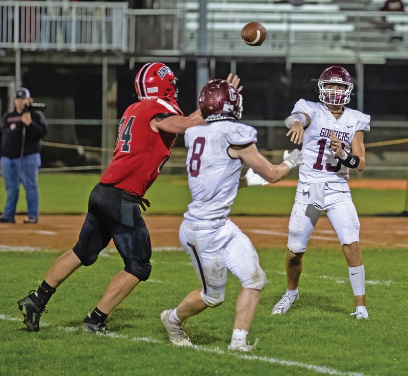 Chatfield QB Carter Ask flips a quick pass toward Owen Collett in the Gophers contest at Cannon Falls. Behind D’Andre Williams’ three touchdowns, Chatfield improved to 3-0 with a 24-6 victory. Photo by Leif Erickson