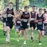 LARPH runners Isaac Rasmussen, Trey Hegland and Grayson Speltz lead the pack at a home four-team cross country meet. The #3-ranked Card-Tro-Cane boys won said team competition with the above trio claiming the top three spots. Photo by Dawn Hauge: