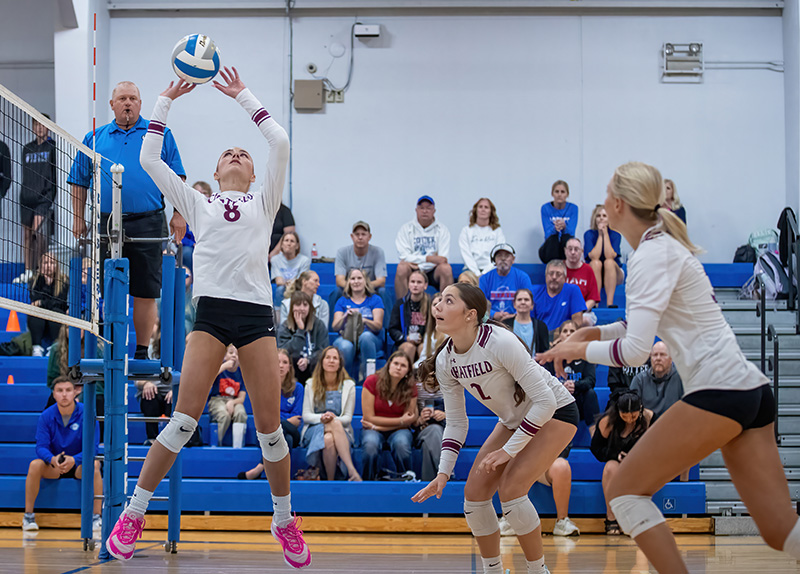 Chatfield attackers Cora Bicknese (far) and Grace Schroeder (near) eye Harper Goldsmith’s set in Chatfield’s matchup with Cotter/Hope Lutheran. A rematch of last year’s 1AA title game, the Gophers again were victorious by 3-0 sweep. Photo by Leif Erickson