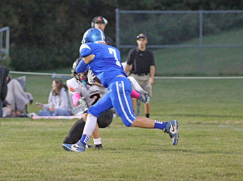 Mabel-Canton’s Darian Hershberger has a reception and looks to break the tackle of Lanesboro’s Quadyn Kettner in the teams’ South-East week three matchup. M-C scored the final 28 points of the game to post a 50-26 win. Photo by Paul Trende