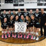 Posing with this year’s Falcons, Fillmore Central head volleyball coach Travis Malley (far right) won his 200th career match when FC downed St. Charles. Malley has been head coach of the Falcons since 2014, averaging around 18 wins a campaign with no below-five-hundred seasons. Photo by Deb Finseth