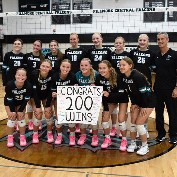 Posing with this year’s Falcons, Fillmore Central head volleyball coach Travis Malley (far right) won his 200th career match when FC downed St. Charles. Malley has been head coach of the Falcons since 2014, averaging around 18 wins a campaign with no below-five-hundred seasons. Photo by Deb Finseth