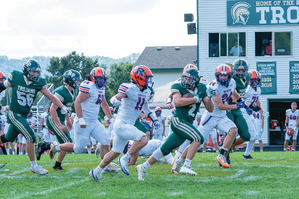 Rushford-Peterson’s Jaxson Meldahl gets good yardage on a counter in the first half of the Trojans 21-20 win over Randolph for homecoming. The game climaxed when the Rockets fumbled a game-winning two-point conversion into the end zone with 0:17 left, cementing a 21-20 R-P win. Photo by Dawn Hauge