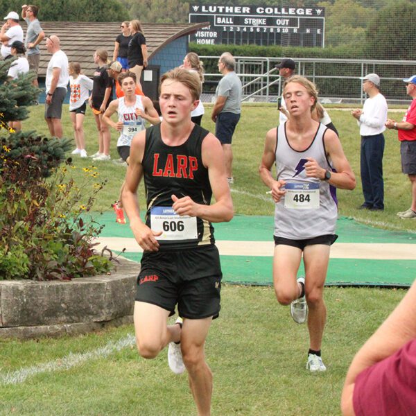 LARPH Isaac Rasmussen (left) is within a few hundred yards of the finish at the Luther All-American cross country meet. Featuring many ranked runners and teams from the Tri-State area, Rasmussen took an impressive 11th place (of over 200 competitors) to help his team to a strong fifth place showing. Photo by Paul Trende