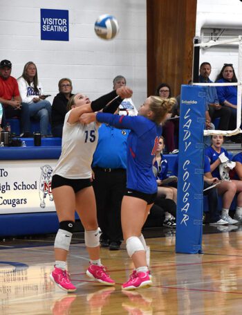 Mabel-Canton’s Lauren Burke (left) and Gwen Rein (right) each go for the ball in Mabel-Canton’s key 3-1 win over SEC-West leading Southland. The #4-ranked and SEC-East leading Cougars went 7-1 on the week to improve to 15-1 on the year. Photo by Heather Kleiboer