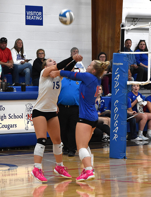 Mabel-Canton’s Lauren Burke (left) and Gwen Rein (right) each go for the ball in Mabel-Canton’s key 3-1 win over SEC-West leading Southland. The #4-ranked and SEC-East leading Cougars went 7-1 on the week to improve to 15-1 on the year. Photo by Heather Kleiboer