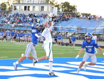 Fillmore Central’s Quinci Kaase makes the nice TD reception to start Fillmore Central’s scoring in their Thursday season-opening win over Janesville-Waldorf-Pemberton, 50-18. Photo by Deb Finseth