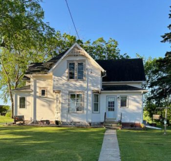 The 120-year-old farmhouse before the move. Photo submitted