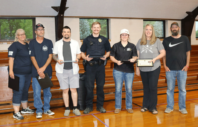 Caleb Hareldson, far right, stands with many of those who helped to save his life on April 30, 2025. From the left: Darcy Peterson, EMR - Preston Ambulance; Paul Peterson, EMT - Preston Ambulance; Jackson Orlowski, EMT - Preston Ambulance; Connor Simon - Preston Police Department, Katelyn Melver - Fillmore County Sheriff’s Office, telecommunicator; Samantha Hareldson and Caleb. Photo by Barb Jeffers