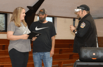Caleb Hareldson presents his wife Samantha with a CPR award during the awards ceremony held at the Lanesboro Community Hall on June 18, 2025. Sam performed CPR on her husband until EMTs arrived on the scene. Photo by Barb Jeffers