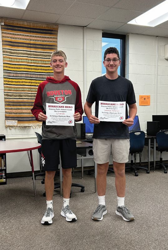 C.J. Wruck, left, and Coleman Peterson, right, were honored as Hurricane Heroes. Photo by Wanda Hanson