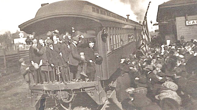 Who? Some well-accompanied dignitary, probably a politician on a scheduled campaign stop, address a large crowd at Caledonia from the rear platform of a passenger train. Dated around 1915, can anyone identify who attracted such a crowd? Photo courtesy of the Houston County Historical Society