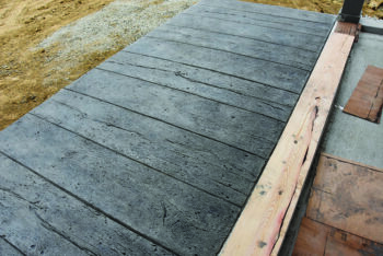 The concrete sidewalk at Preston Depot Museum and Riverfront Center is made to look like weathered boards, which adds to the functional aesthetics of Depot. Photo by Charlene Corson Selbee