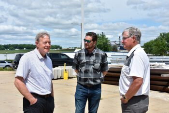 John Baer, SVP Manufacturing and Distribution, Caledonia Mayor Jeremy Leis, and Council Member Bob Klug at June 17 check presentation ceremony in Caledonia. Photo by Charlene Corson Selbee