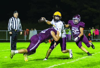 Chatfield’s Mitchel Hinckley (near) and Eli Manahan (#66) combine to sack Dover-Eyota quarterback Cooper Kellen late in the Gophers 26-14, defensive and special teams led, win. The Gophers are 2-0. Photo by Leif Erickson