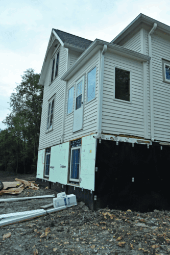 The new daylight basement brings in natural light; landscaping is not finished. Photo submitted