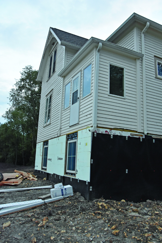 The new daylight basement brings in natural light; landscaping is not finished. Photo submitted