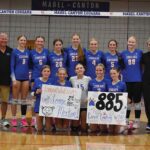 Mabel-Canton head volleyball coach Lonnie Morken (second from left in back row) poses with his team and assistant coaches after winning his 885th career match versus Kingsland. Doing so moved Morken into second place all-time in state history behind Stewartville former head John Dzubay (1,039). Photo by Heather Kleiboer
